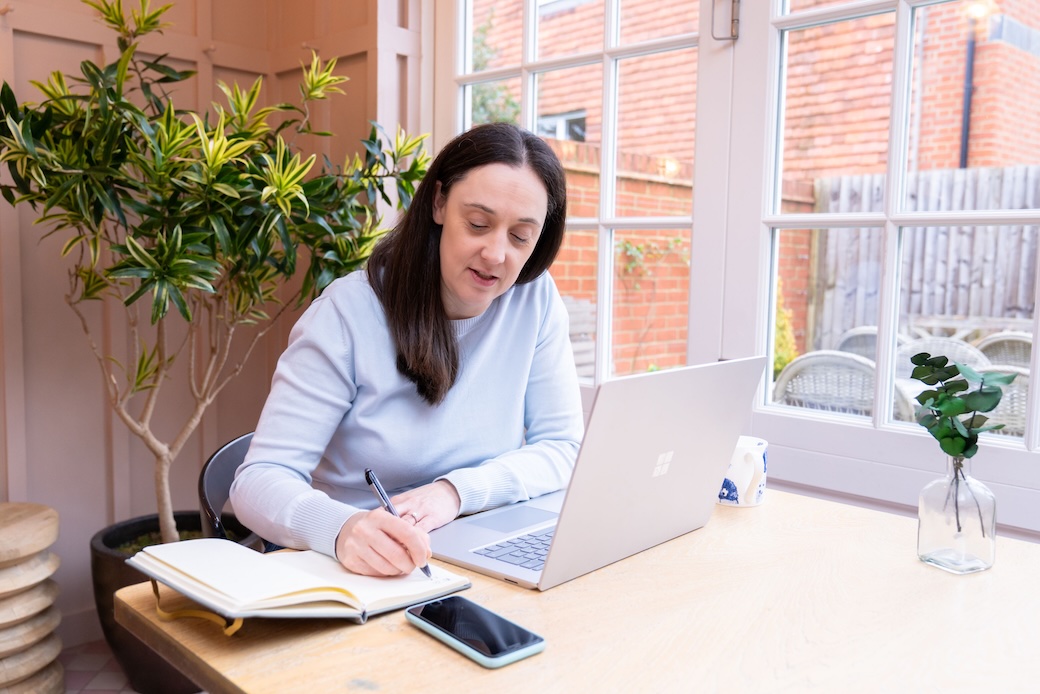 An office worker with a laptop computer